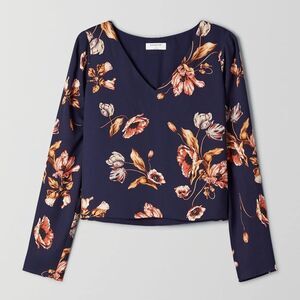 Babaton Navy V-Neck Blouse with Warm Floral Print